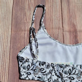 Top de Bikini Estilo Brasileño Niña DESIRE Blanco Flores Negras